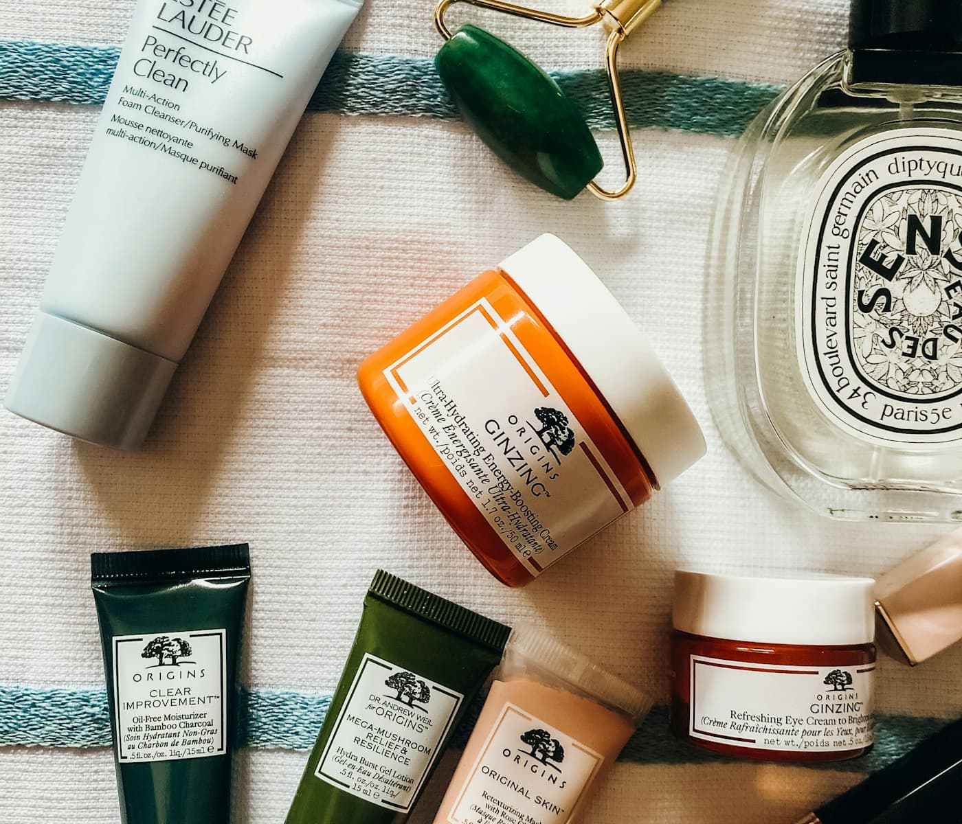 Skincare ritual flatlay with serums and a jade roller